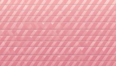 The primary subject of the image is a pink wall with a pattern of triangles. The setting is a room with a pink tiled wall, and the visual style is a close-up of the wall. The dominant colors are pink and white, creating a warm and inviting atmosphere.