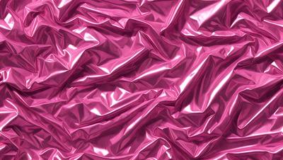 The primary subject of the image is a close-up of a pink, shiny, and wrinkled surface, which appears to be a piece of plastic or a similar material. The setting is a pink background, which complements the pink surface. The visual style is a close-up, focusing on the details of the pink material. The colors and mood of the image are predominantly pink, creating a warm and vibrant atmosphere.