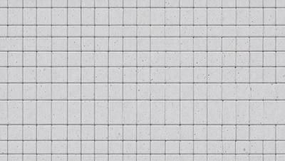 The primary subject of the image is a white tile wall. The setting is a room with a white tile floor. The visual style is a close-up of the tiles, which gives the image a clean and minimalist appearance. The colors and mood are predominantly white, creating a calm and serene atmosphere.