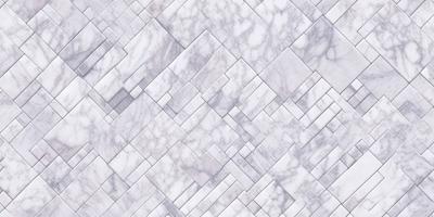 The primary subject of the image is a marble tile pattern. The setting is a white marble tile wall, which serves as the background. The visual style is a close-up of the marble tile pattern, showcasing the intricate details of the design. The colors and mood of the image are predominantly white, giving it a clean and elegant appearance.