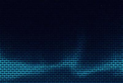 The primary subject of the image is a brick wall. The setting is a dark, blue-toned environment, possibly a nighttime cityscape. The visual style is a combination of a photo and digital art, creating a unique and intriguing atmosphere. The dominant colors are blue and black, giving the image a moody and mysterious feel.