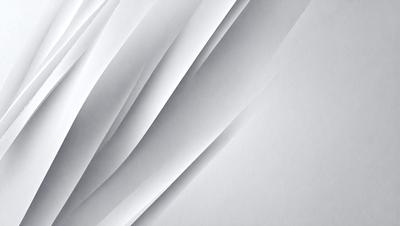 The primary subject of the image is a white sheet of paper with a pattern of folded edges. The paper appears to be a part of a larger sheet, and the folded edges create a visually interesting texture. The setting is a white background, which provides a clean and minimalist appearance. The visual style is a close-up of the paper, showcasing the intricate details of the folded edges. The colors and mood of the image are predominantly white, giving it a clean and simple aesthetic.