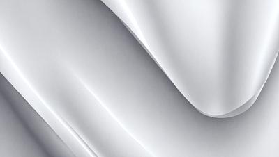 The primary subject of the image is a white sheet of paper. The setting is a room with a table, and the visual style is a close-up of the paper. The colors and mood of the image are predominantly white, giving it a clean and minimalist appearance.