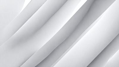 The primary subject of the image is a stack of white paper. The setting is a white background, which creates a clean and minimalist appearance. The visual style is a close-up of the paper, emphasizing its texture and details. The colors and mood are predominantly white, giving the image a calm and serene atmosphere.
