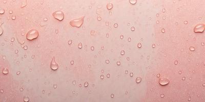 The primary subject of the image is a close-up of a pink surface with water droplets on it. The setting is a pink background, and the visual style appears to be a photo. The colors and mood of the image are predominantly pink, creating a warm and inviting atmosphere.