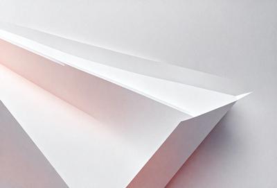 The primary subject of the image is a series of three white paper strips, which are arranged in a row. The setting is a white background, which provides a clean and minimalist appearance. The visual style is a close-up of the paper strips, showcasing their texture and details. The colors are predominantly white, giving the image a clean and simple mood.