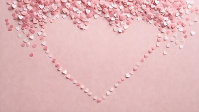 The primary subject of the image is a heart-shaped design made of pink and white hearts. The heart is placed on a pink background, which creates a warm and romantic atmosphere. The visual style of the image is a combination of digital art and illustration, as the hearts are arranged in a visually appealing manner. The colors and mood of the image are predominantly pink and white, which are often associated with love and affection.
