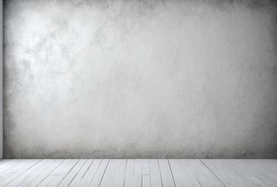 The primary subject of the image is a white wall with a grey texture. The setting is a room with a wooden floor. The visual style is a photo, and the dominant colors are white and grey. The overall atmosphere is clean and minimalistic.