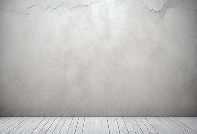The primary subject of the image is a large, empty white wall. The setting is a room with a concrete surface, and the visual style is a photo. The colors and mood of the image are predominantly white, giving it a clean and minimalist appearance.