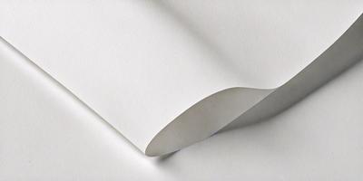 The primary subject of the image is a white sheet of paper. The setting is a white background, and the visual style is a photo. The colors and mood of the image are predominantly white, giving it a clean and minimalist appearance.