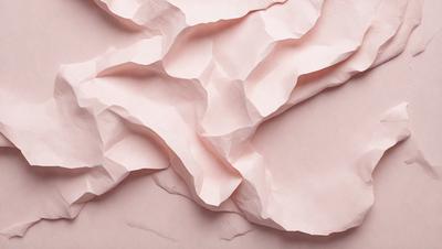 The primary subject of the image is a pink paper with a creased texture. The setting is a pink background, which adds to the overall mood of the image. The visual style is a combination of a photo and a drawing, creating a unique and artistic representation of the paper. The colors and mood of the image are predominantly pink, giving it a warm and inviting atmosphere.