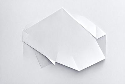 The primary subject of the image is a white paper cutout of a car. The setting is a white background, and the visual style appears to be a digital art or illustration. The colors are predominantly white, giving the image a clean and minimalist appearance. The overall mood of the image is simple and straightforward, focusing on the car cutout as the main subject.