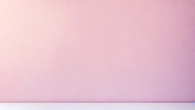 The primary subject of the image is a large, blank wall painted pink. The setting is a room with a pink wall, and the visual style is a close-up of the wall. The colors and mood of the image are predominantly pink, creating a warm and inviting atmosphere.