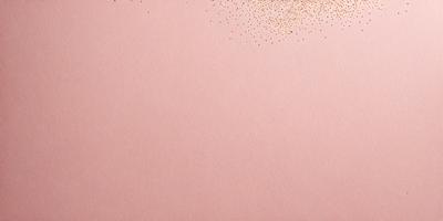 The primary subject of the image is a pink background with a pattern of gold glitter. The setting is a white wall, and the visual style is a combination of a photo and digital art. The colors and mood of the image are predominantly pink and glittery, creating a warm and festive atmosphere.
