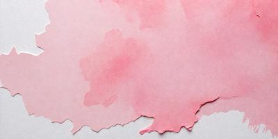 The primary subject of the image is a piece of pink paper with a watercolor-like design on it. The paper appears to be torn or damaged, giving it a somewhat aged or worn appearance. The setting is a white surface, likely a table, where the paper is placed. The visual style of the image is a combination of watercolor and torn paper, creating a unique and artistic effect. The colors and mood of the image are predominantly pink, which gives it a warm and inviting atmosphere.