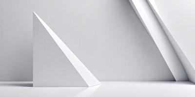 The primary subject of the image is a white triangle, which is the main object, scene, or focus of the image. The setting or background consists of a white wall, which provides a clean and minimalistic environment. The visual style of the image is a photo, showcasing the triangle's shape and texture. The colors and mood of the image are predominantly white, creating a sense of simplicity and purity.