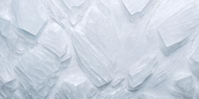 The image features a white rock wall with a pattern of white and gray rocks. The wall appears to be made of marble, giving it a smooth and polished appearance. The rocks are arranged in a way that creates a visually appealing and textured surface. The overall atmosphere of the image is clean and elegant, with the white and gray color palette adding a sense of calmness and sophistication.
