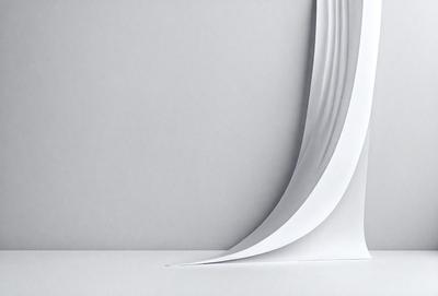 The primary subject of the image is a white sheet of paper. The setting is a white wall, and the visual style is a photo. The colors and mood of the image are predominantly white, giving it a clean and minimalist appearance.