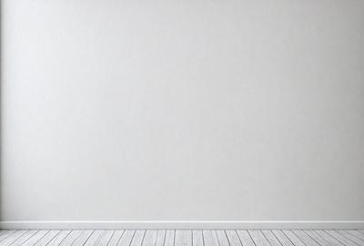 The primary subject of the image is a white wall with a white frame. The setting is a room with a white floor. The visual style is a photo, and the colors and mood are predominantly white, creating a clean and minimalist atmosphere.