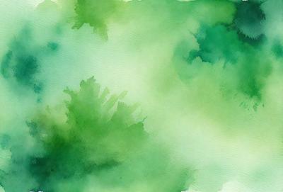 The primary subject of the image is a green, watercolor-style painting of a forest. The setting is a lush, green environment with trees and foliage. The visual style is a watercolor painting, which gives the image a unique, artistic appearance. The dominant colors are green, with some shades of blue and yellow, creating a serene and natural atmosphere.