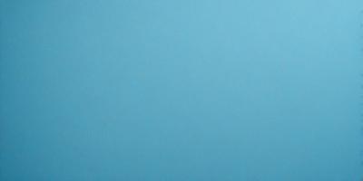 The primary subject of the image is a large, empty blue sky. The setting is a vast, open space with no visible landmarks or objects. The visual style is a natural, untouched landscape. The colors and mood are predominantly blue, creating a calm and serene atmosphere.