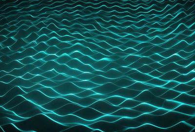 The primary subject of the image is a blue ocean with ripples and waves. The setting is a vast body of water, and the visual style is a photo of the ocean. The dominant colors are blue and white, creating a serene and calming atmosphere.