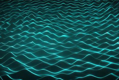 The primary subject of the image is a blue ocean with ripples and waves. The setting is a vast body of water, and the visual style is a photo of the ocean. The dominant colors are blue and white, creating a serene and calming atmosphere.