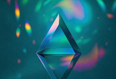 The primary subject of the image is a blue and green geometric shape, which appears to be a three-dimensional representation of a cube. The setting is a blue background, which complements the colors of the geometric shape. The visual style of the image is a combination of digital art and illustration, creating a unique and eye-catching design. The dominant colors in the image are blue and green, giving it a calming and soothing atmosphere.