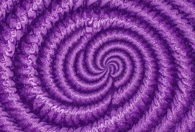 The primary subject of the image is a purple spiral pattern, which is the main object, scene, or focus of the image. The setting or background of the image is a purple surface, which could be a wall, fabric, or other material. The visual style of the image is a digital art or illustration, as it is a well-defined and detailed pattern. The dominant colors in the image are purple and possibly other shades of purple, creating a calm and soothing atmosphere.