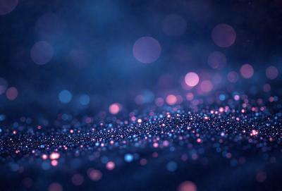 The primary subject of the image is a blue background with a pattern of bright, colorful lights. The setting appears to be a dark, starry night, with the lights creating a mesmerizing effect. The visual style of the image is a combination of a photo and digital art, as it captures the beauty of the night sky with the vibrant lights. The colors and mood of the image are predominantly dark and moody, with the bright lights adding a touch of warmth and energy to the scene.