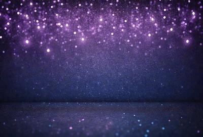 The primary subject of the image is a purple background with a starry pattern. The setting is a dark room, and the visual style is a photo. The colors and mood of the image are predominantly purple, creating a calm and serene atmosphere.