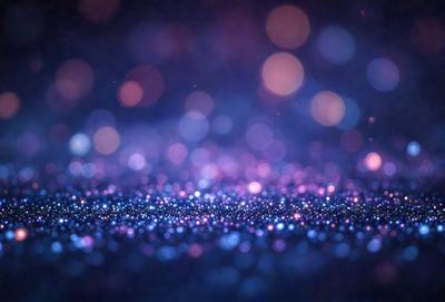 The primary subject of the image is a blue background with a pattern of bright, colorful lights. The setting appears to be a dark room, and the visual style is a combination of a photo and digital art. The colors and mood of the image are vibrant and lively, with the bright lights creating a sense of energy and excitement.