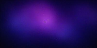 The primary subject of the image is a purple background with a star pattern. The setting is a dark, purple sky, and the visual style is a digital art or illustration. The colors and mood of the image are predominantly purple, creating a calm and serene atmosphere.