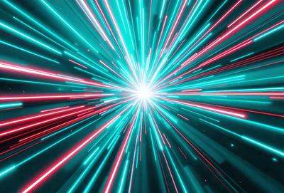 The primary subject of the image is a bright, colorful, and vibrant explosion of light. The setting is a dark background, which contrasts with the bright colors of the light. The visual style is a combination of a photo and digital art, creating a dynamic and eye-catching scene. The colors and mood of the image are predominantly blue and green, giving it a lively and energetic atmosphere.