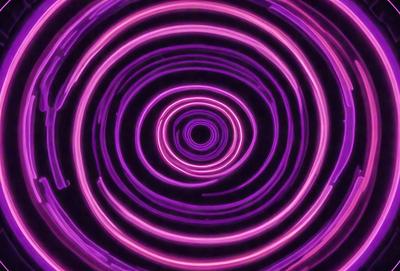 The primary subject of the image is a purple spiral, which appears to be a neon light or a purple circle. The setting is a dark background, which contrasts with the bright purple spiral. The visual style is a close-up of the spiral, emphasizing its shape and color. The colors and mood of the image are predominantly purple, creating a visually striking and somewhat mysterious atmosphere.