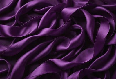 Purple fabric with a flowing pattern.