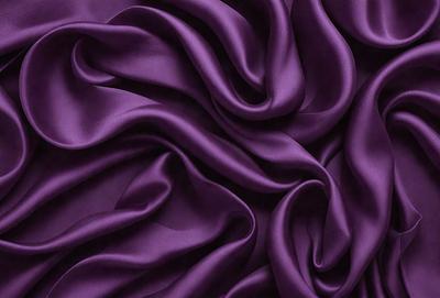 Purple fabric with a flowing pattern.