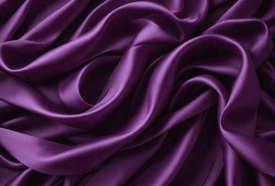 Purple fabric with a flowing pattern.