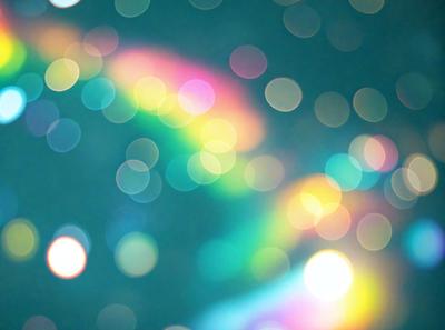 The primary subject of the image is a colorful, rainbow-like pattern or design. The setting is a dark blue background, which contrasts with the vibrant colors of the pattern. The visual style appears to be a combination of digital art and illustration, creating a unique and eye-catching design. The colors and mood of the image are lively and energetic, with the bright colors and contrasting background creating a dynamic and engaging atmosphere.