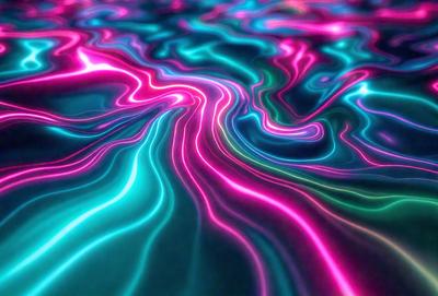 The primary subject of the image is a vibrant, colorful, and swirling pattern that resembles a water surface. The setting is a blue ocean, and the visual style is a combination of photo and digital art. The dominant colors are blue, pink, and green, creating a lively and energetic atmosphere.