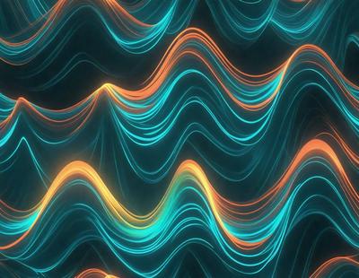 The primary subject of the image is a blue and orange wave pattern. The setting is a dark background, which contrasts with the vibrant colors of the wave pattern. The visual style is a digital art or illustration, creating a dynamic and eye-catching design. The dominant colors are blue and orange, giving the image a lively and energetic atmosphere.