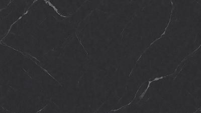 The primary subject of the image is a black marble countertop. The setting is a kitchen, with the countertop being the main focus of the scene. The visual style is a close-up of the marble countertop, showcasing its texture and appearance. The colors and mood of the image are predominantly dark, with the black marble countertop being the main source of contrast and visual interest.