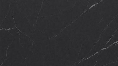 The primary subject of the image is a black marble countertop. The setting is a kitchen, with the countertop being the main focus of the scene. The visual style is a close-up of the marble countertop, showcasing its texture and details. The colors and mood of the image are predominantly dark, with the black marble countertop being the main source of contrast and visual interest.