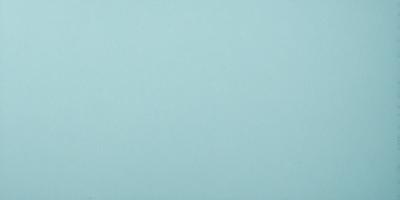The primary subject of the image is a large, empty blue wall. The setting is a room with a blue background, and the visual style is a photo. The dominant colors are blue and white, creating a calm and serene atmosphere.