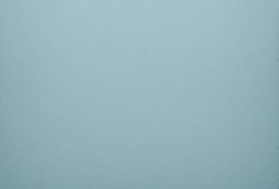 The primary subject of the image is a large, empty, and dark blue sky. The setting is a vast, open space with no visible landmarks or objects. The visual style is a natural, untouched, and unaltered representation of the sky. The colors and mood convey a sense of tranquility and vastness.