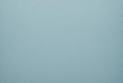The primary subject of the image is a large, empty, and dark blue sky. The setting is a vast, open space with no visible landmarks or objects. The visual style is a natural, untouched, and unaltered representation of the sky. The colors and mood convey a sense of tranquility and vastness.