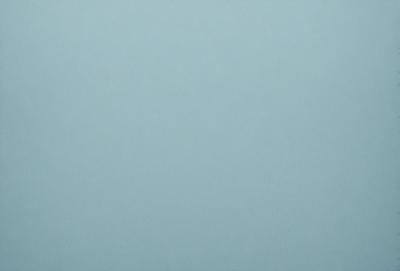 The primary subject of the image is a large, empty, and dark blue sky. The setting is a vast, open space with no visible landmarks or objects. The visual style is a natural, untouched, and unaltered representation of the sky. The colors and mood convey a sense of tranquility and vastness.