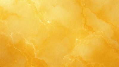 The primary subject of the image is a yellow wall with a marbled texture. The setting is a room with a yellow wall, and the visual style is a close-up of the wall. The dominant colors are yellow and gold, creating a warm and inviting atmosphere.