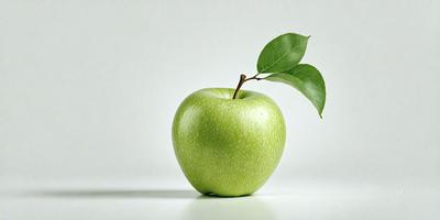 The primary subject of the image is a green apple with a stem, placed on a white surface. The apple is the main focus of the image, and it is positioned in the center of the frame. The setting is a white background, which provides a clean and minimalistic appearance. The visual style is a realistic representation of the apple, and the colors are predominantly green, which gives the image a fresh and natural feel.