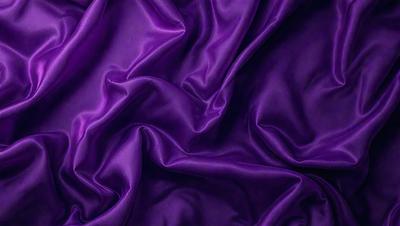 Purple fabric with a flowing pattern.